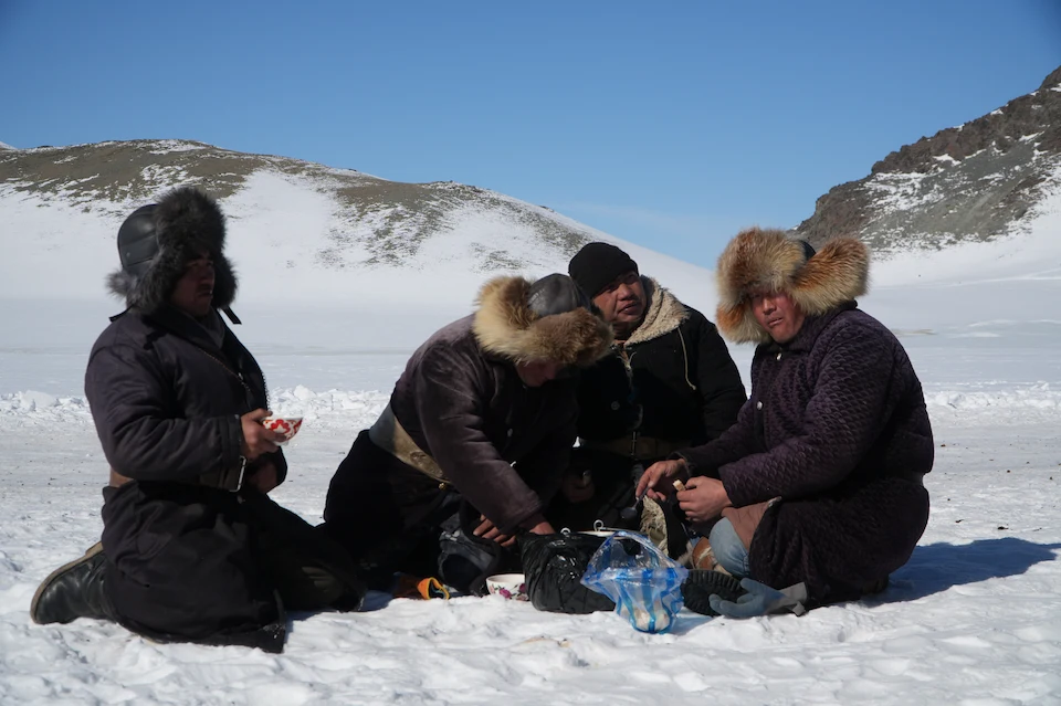 Eagle hunters resting during their winter migration in the Altai