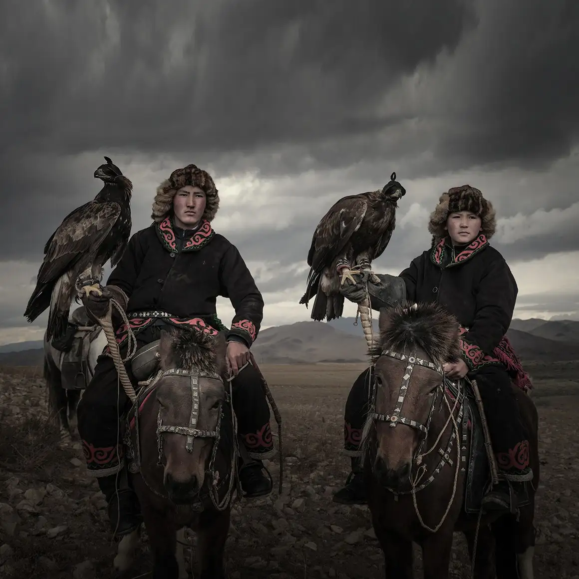 Kazakh eagle hunters on horseback at the Golden Eagle Festival